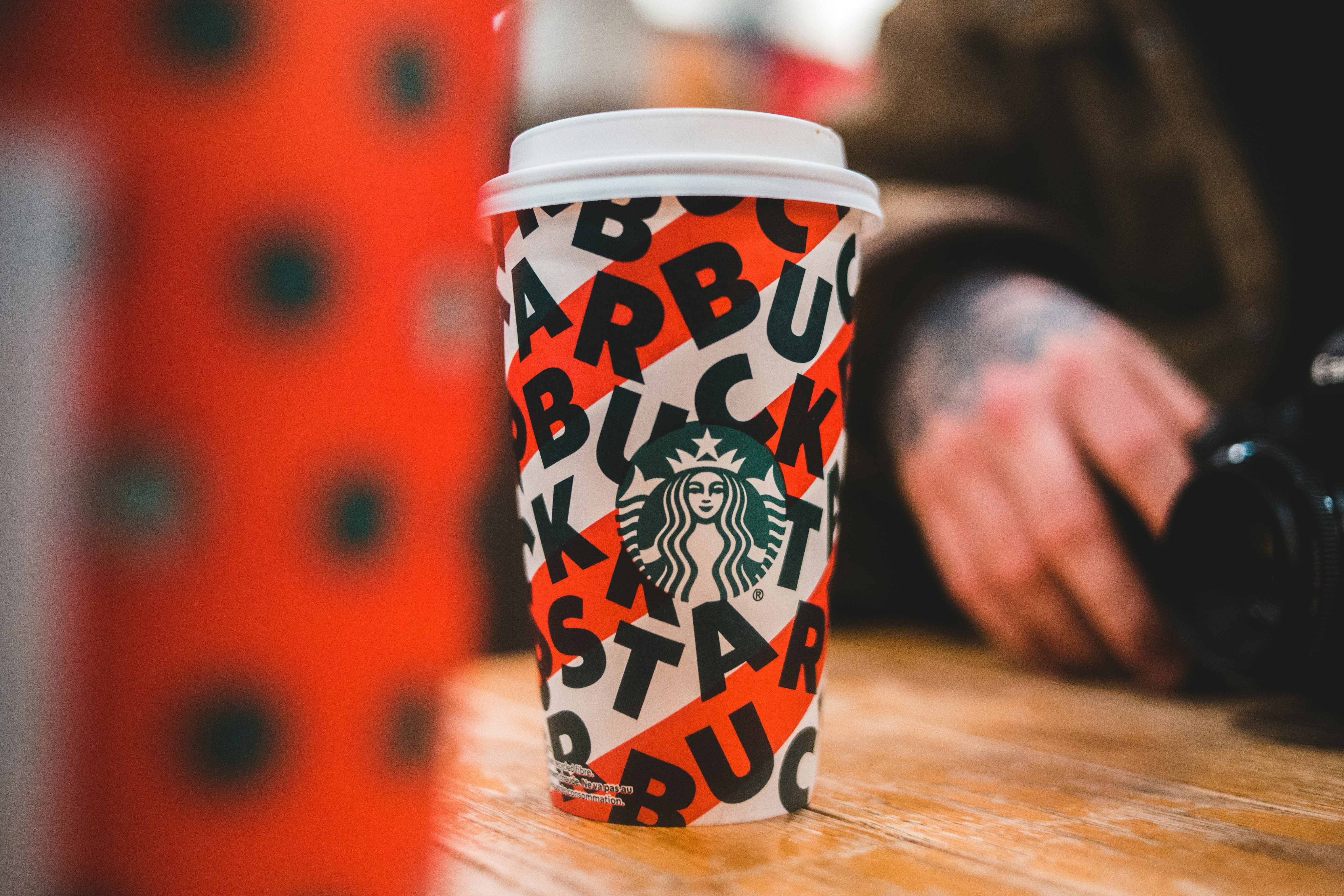 white, black, and red Starbucks cup